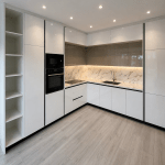 Modern White L-Shaped Kitchen with Marble Glow